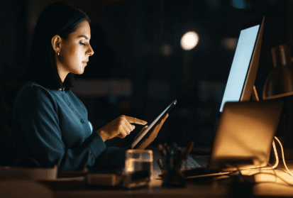 Woman on laptop researching a business online